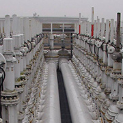 rows of white pipes and tanks